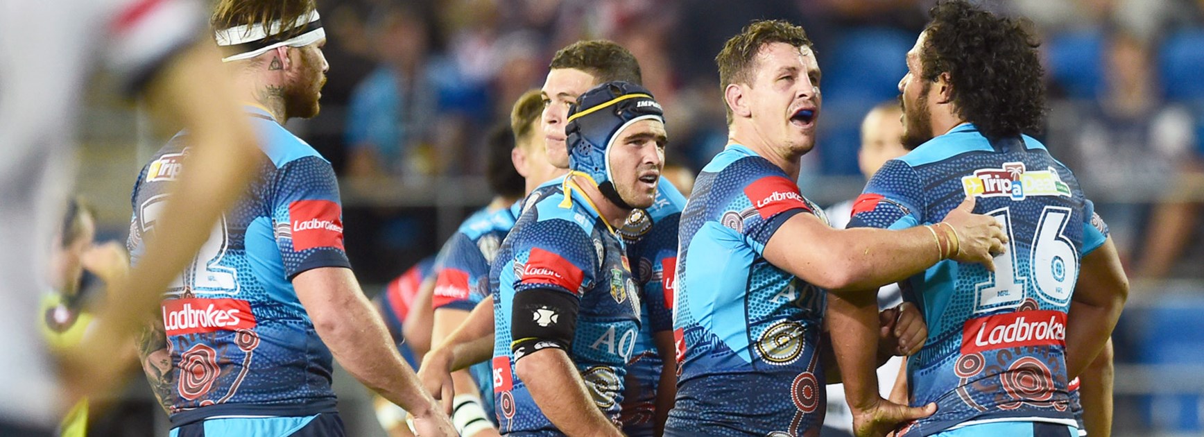 Titans players celebrate against the Roosters in Round 10.