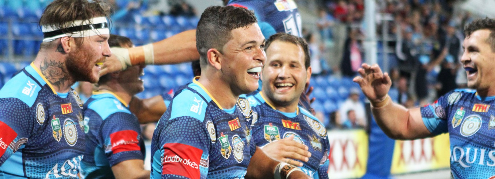 Ashley Taylor celebrates with the Titans during their Indigenous Round win over the Roosters.