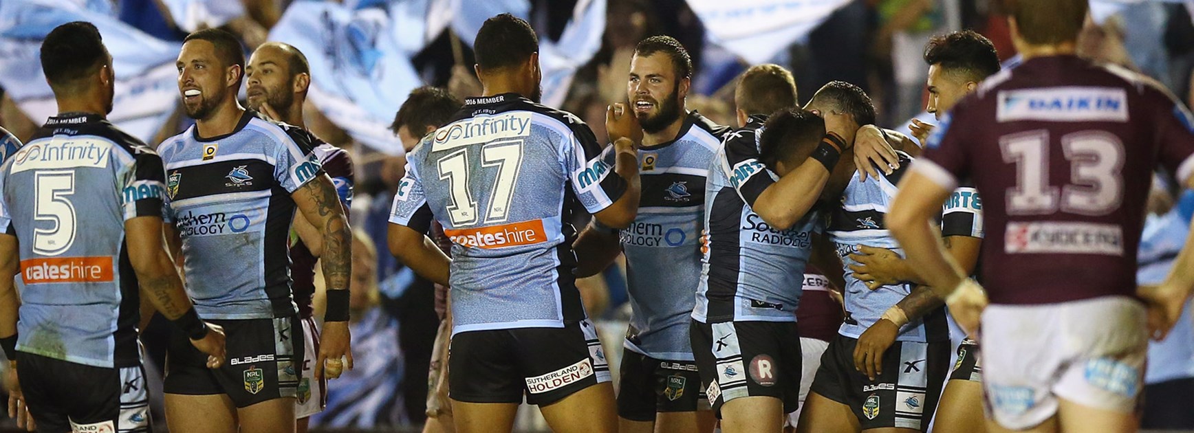 Sharks players celebrate during their Round 11 win over the Sea Eagles.