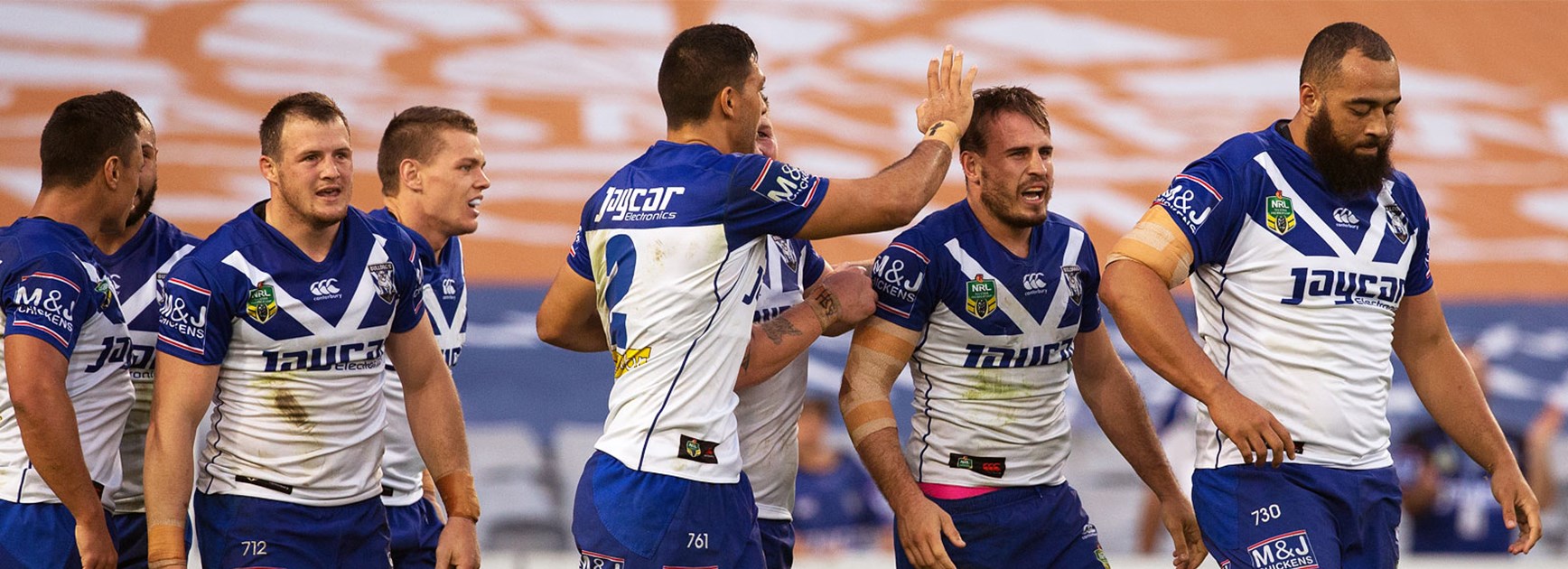 The Bulldogs celebrate Josh Reynolds' first-half try against the Roosters on Sunday.