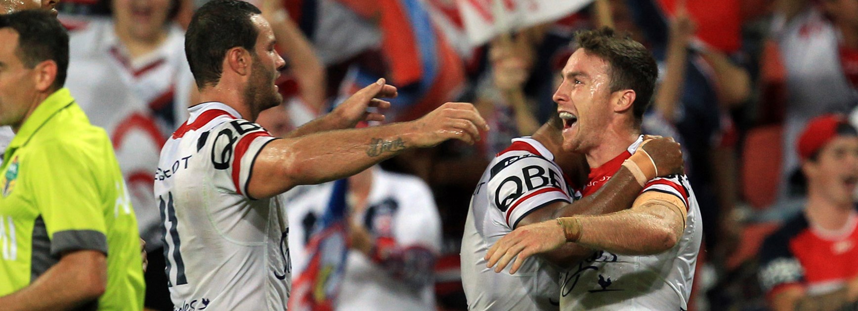 James Maloney celebrates with former Roosters teammates Michael Jennings and Boyd Cordner in 2015.