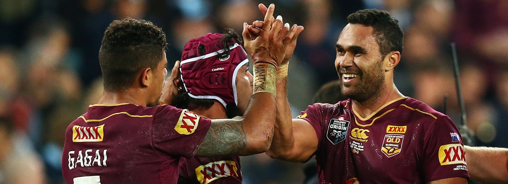 Queensland players Dane Gagai and Justin O'Neill celebrate during Game One.
