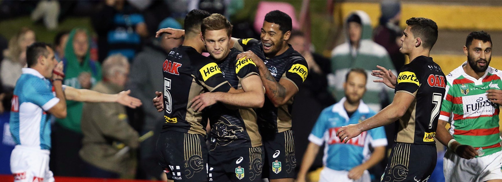 The Panthers celebrate a try against the Rabbitohs on Friday night.