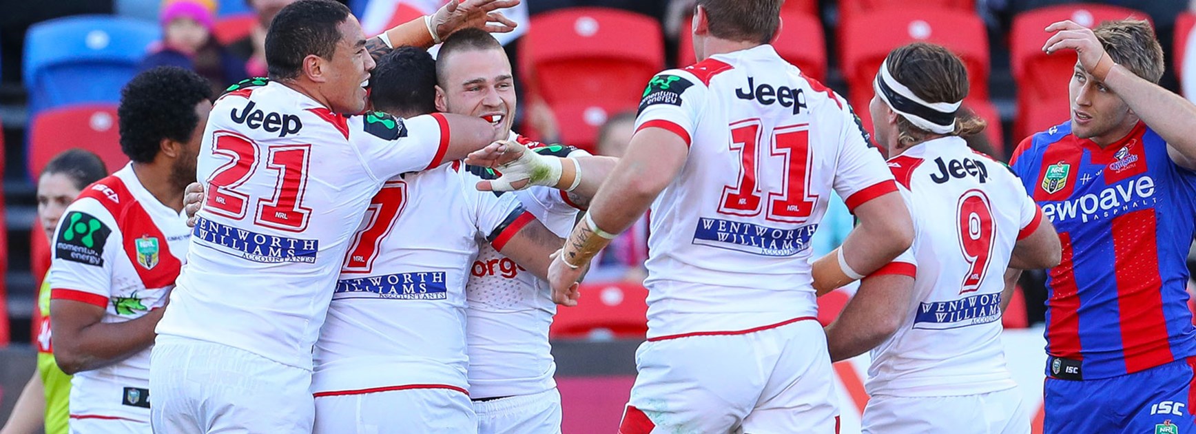 Dragons players celebrate during their Round 16 victory over the Knights.