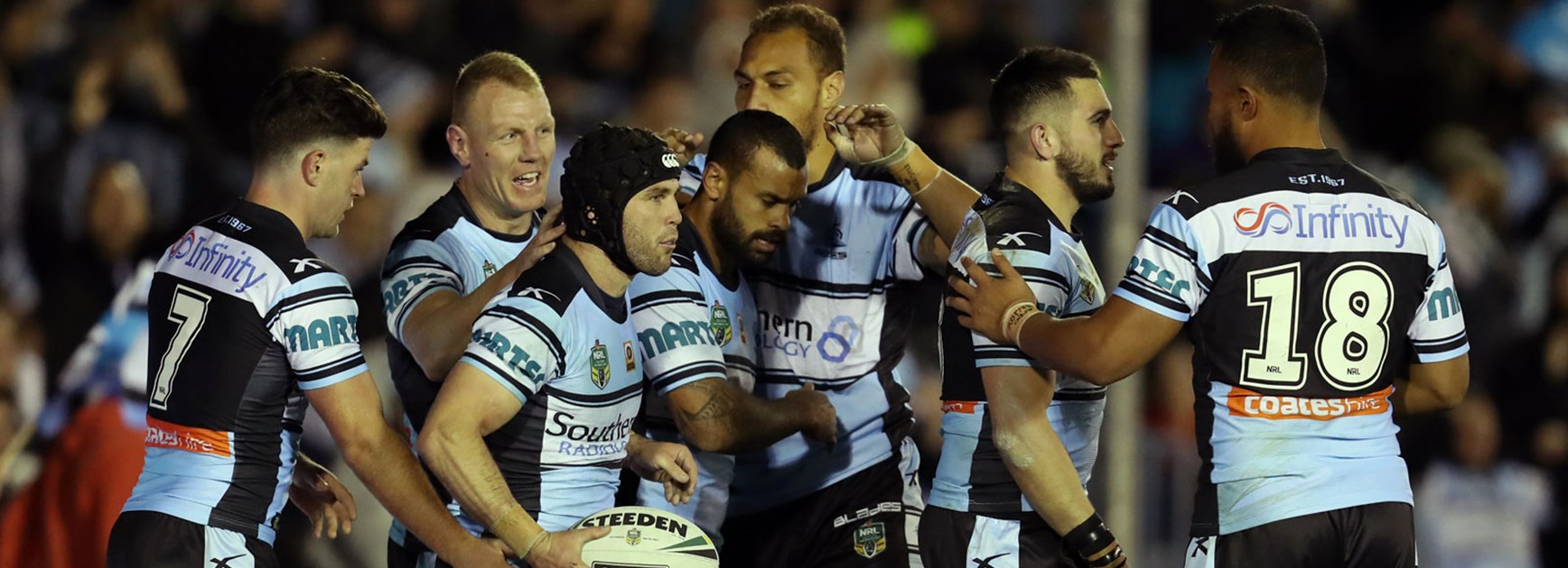 Sharks players celebrate against the Warriors in Round 16.