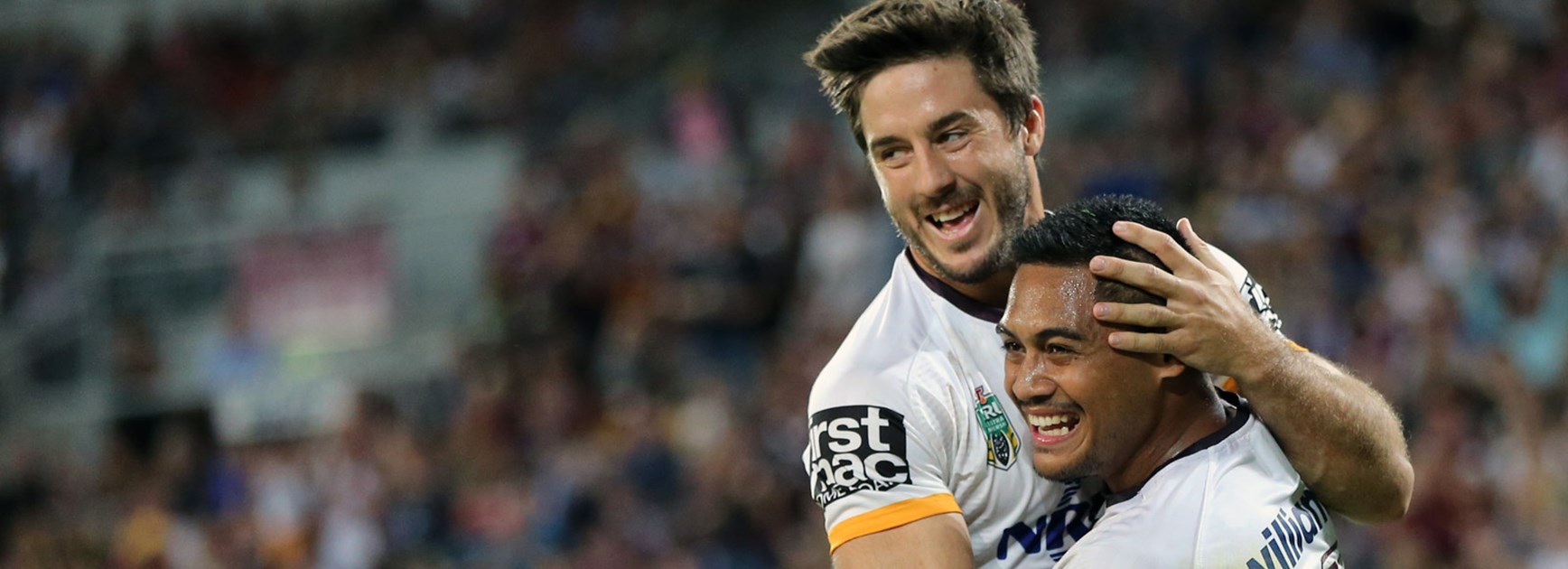 Broncos halves Anthony Milford and Ben Hunt celebrate a try.