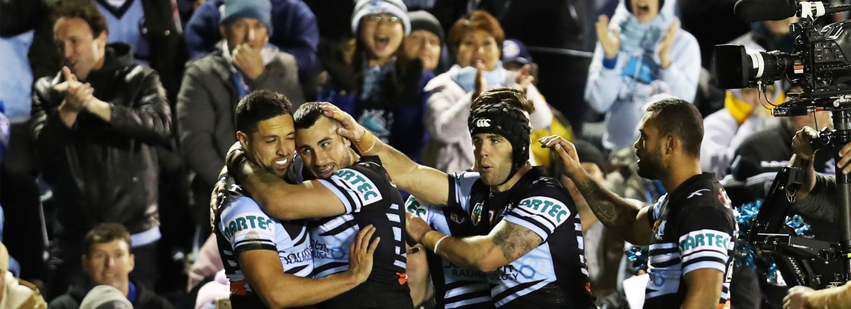 The Sharks celebrate a try against the Eels on Saturday.