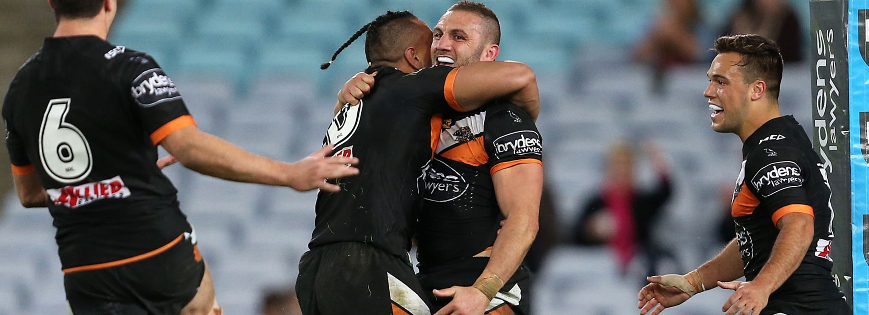 Wests Tigers players celebrate during their win over the Panthers.