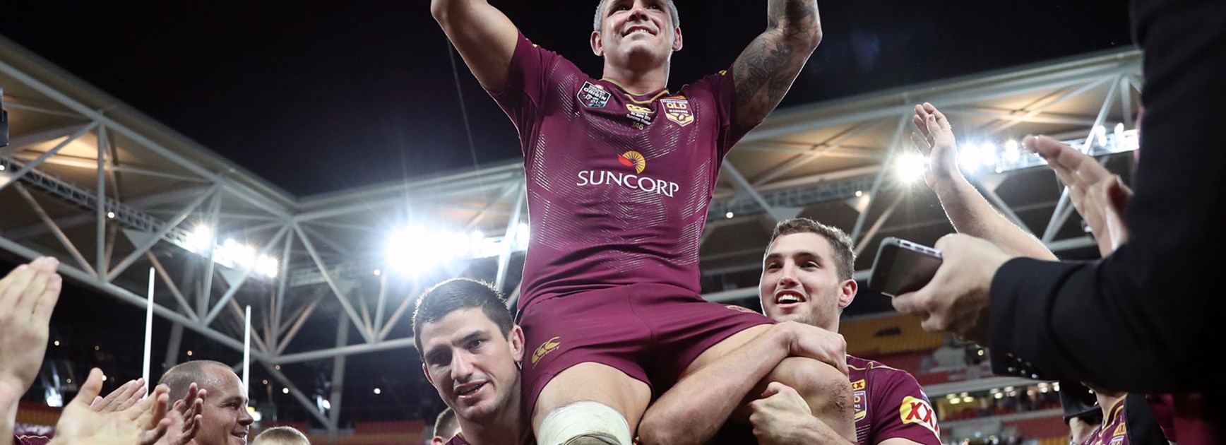 Maroons lock Corey Parker carried off the field in his final Origin appearance at Suncorp Stadium.