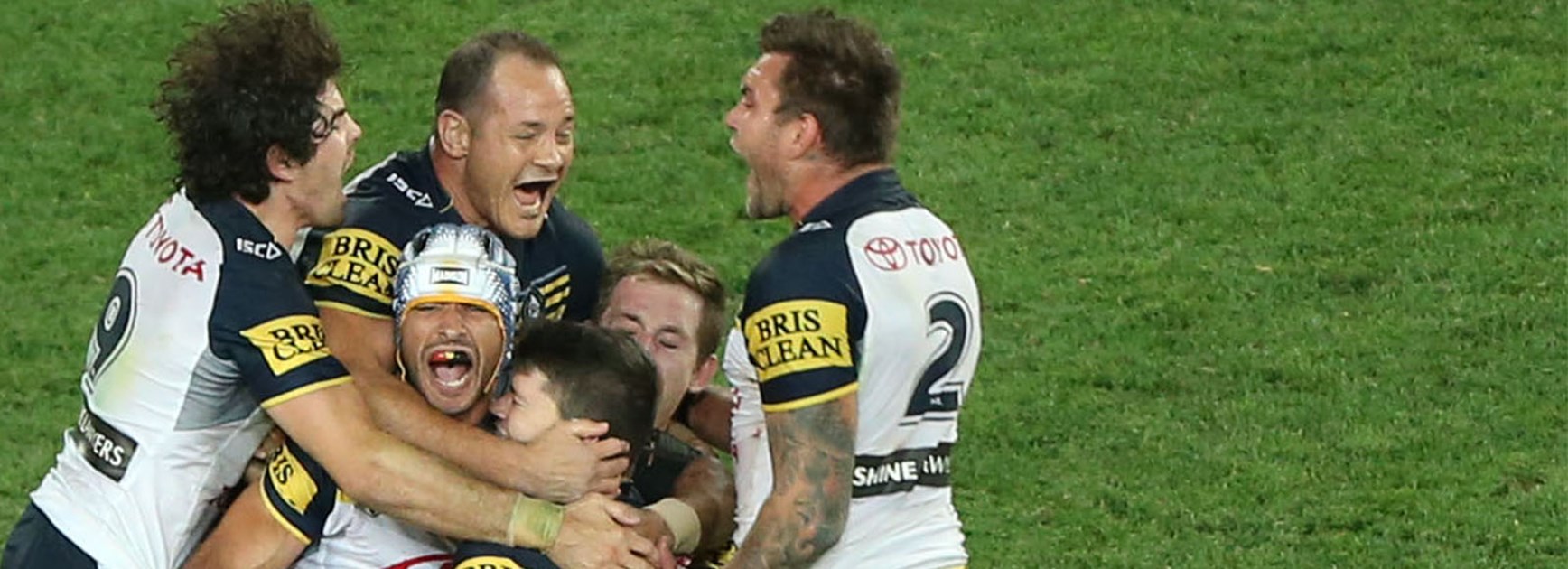 Johnathan Thurston celebrates winning the 2015 grand final with a golden point field goal.