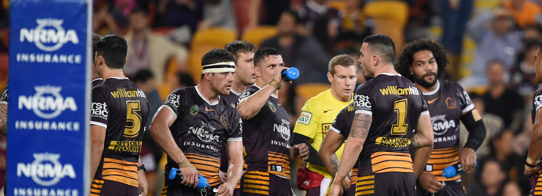 The Broncos look on after another Panthers try in the first half at Suncorp Stadium.