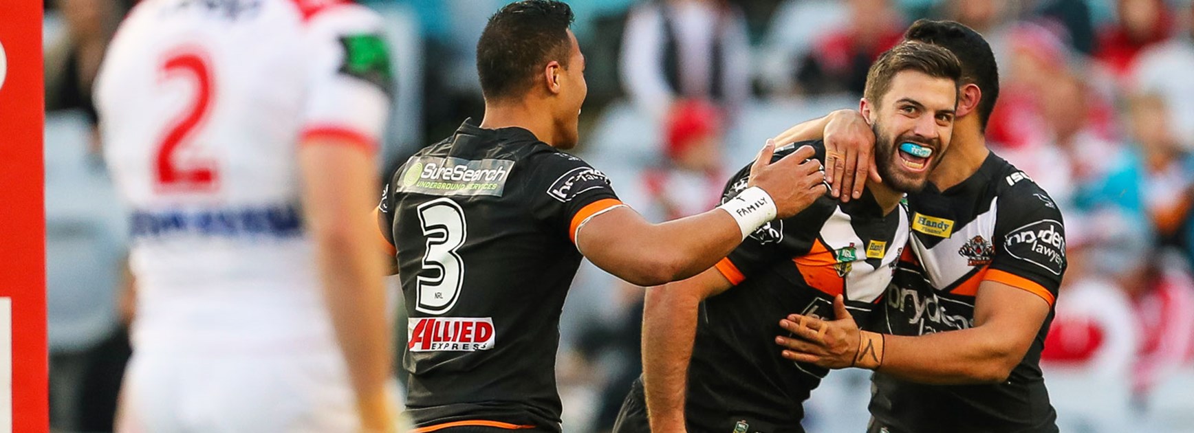 Wests Tigers fullback James Tedesco celebrates against the Dragons in Round 20.