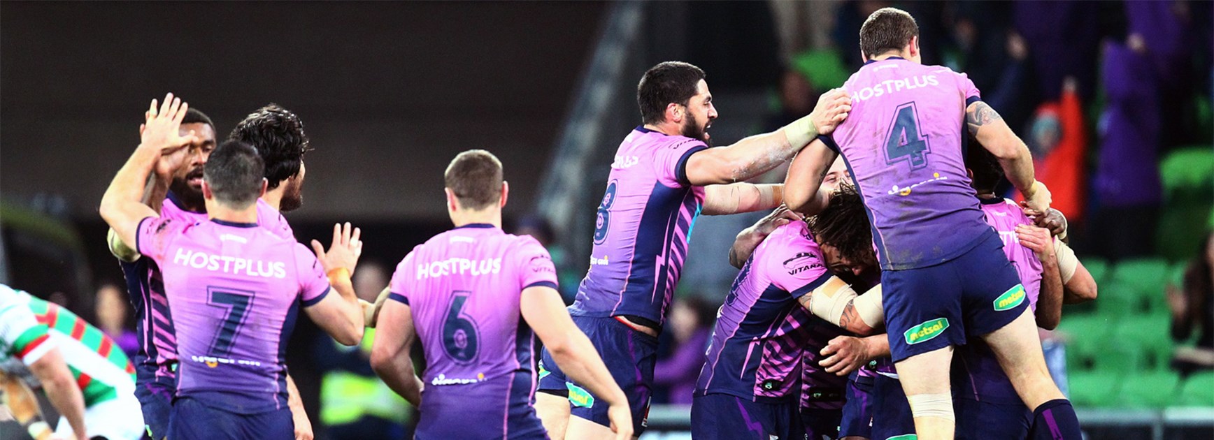 The Melbourne Storm celebrate Cameron Smith's match-winning field goal against the Rabbitohs in Round 22.