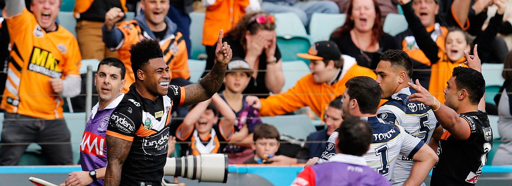 The Wests Tigers celebrate another try against the Cowboys at Leichhardt Oval.