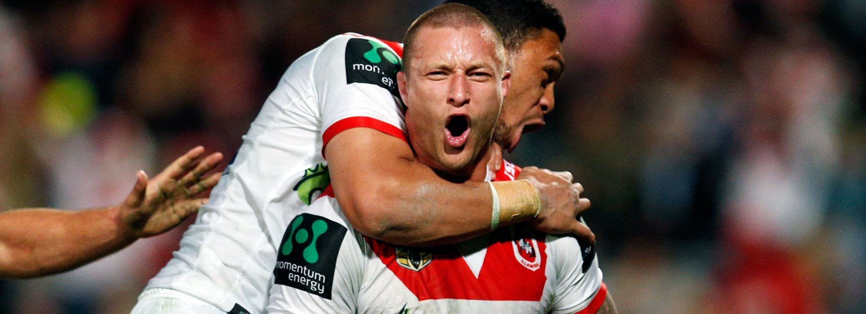 Dragons forward Tariq Sims celebrates one of his two tries against the Sharks.