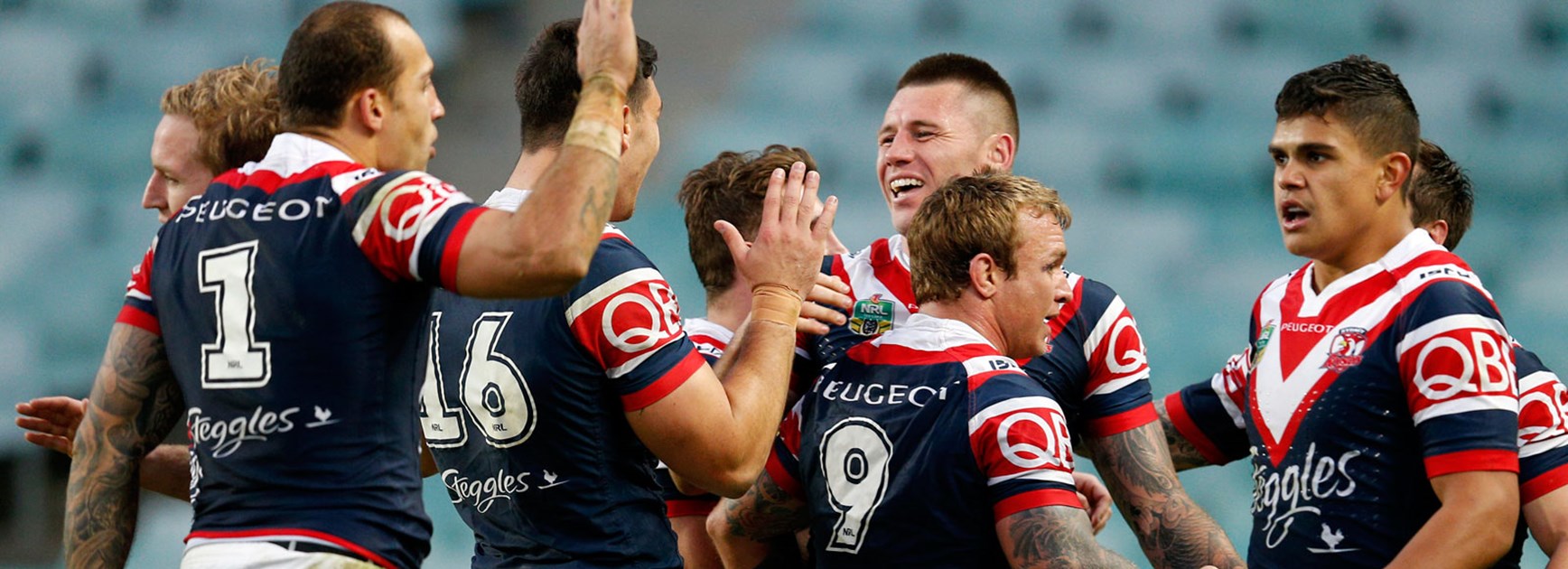 Roosters players celebrate their Round 23 win over the Cowboys.