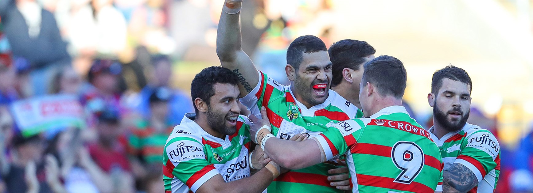 Greg Inglis celebrates a try against the Knights.