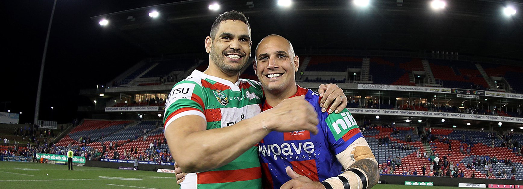 Former teammates Greg Inglis and Jeremy Smith share a moment at Smith's last home game.