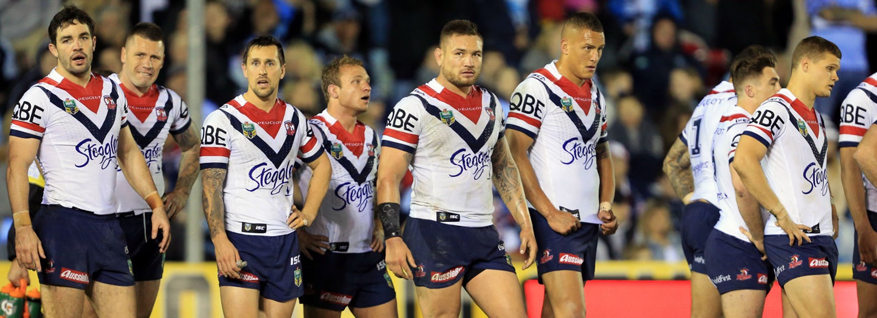Roosters players look on dejected in their loss to the Sharks.