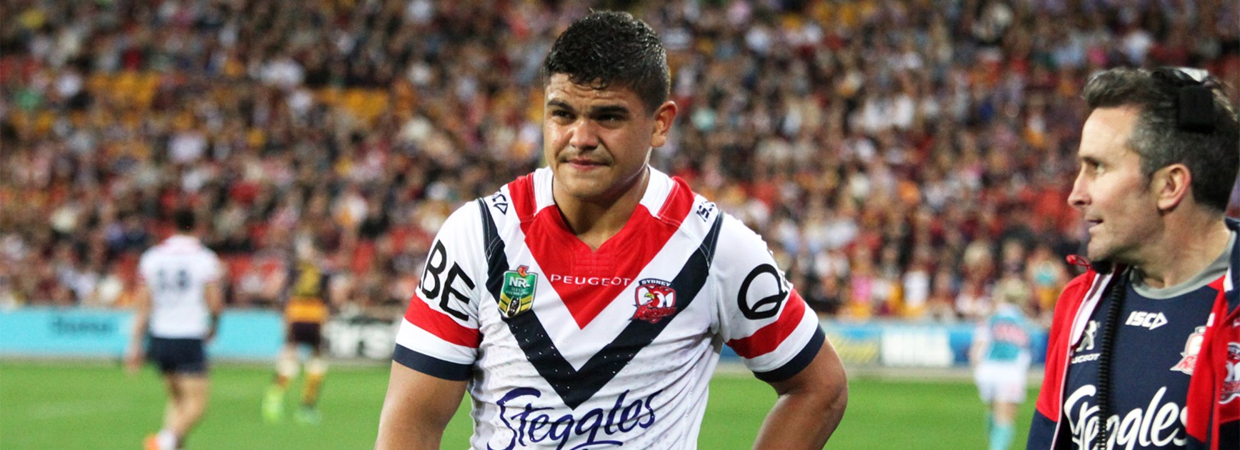 Latrell Mitchell leaves the field with a hip injury on Thursday night.