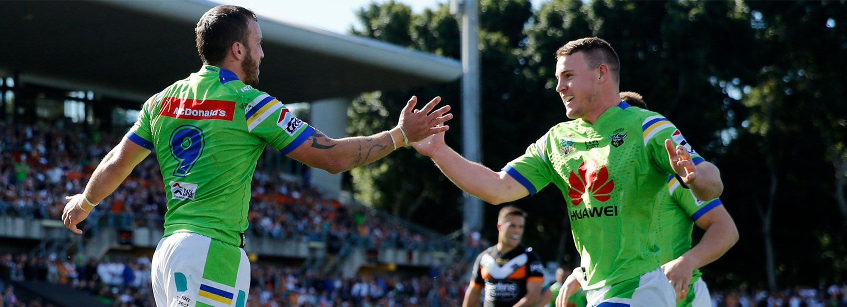 The Tigers celebrate Josh Hodgson's try against the Tigers on Sunday.