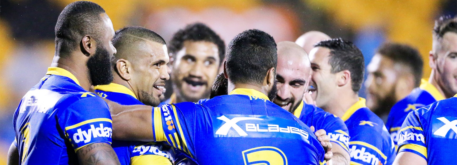 The Eels celebrate a try against the Warriors in Round 26.