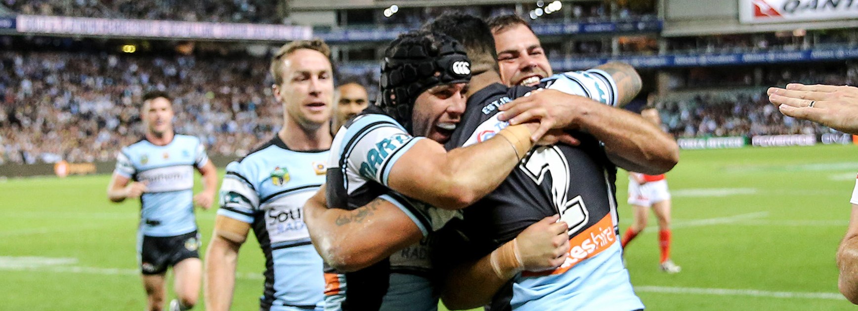 The sharks celebrate the first try of the preliminary final against the Cowboys at Allianz Stadium.