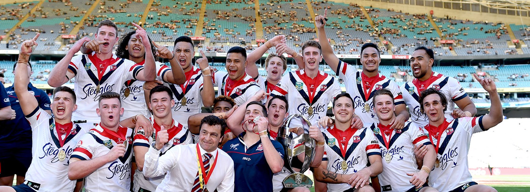 Roosters celebrate winning the Holden Cup.