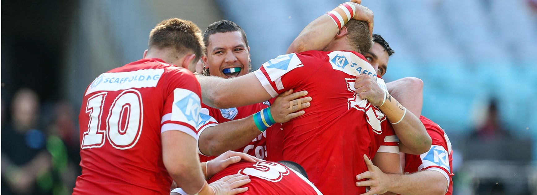 Cutters players celebrate their big Intrust Super Championship win over the Bears.