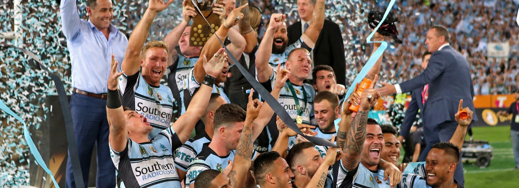 Sharks players celebrate their premiership victory.