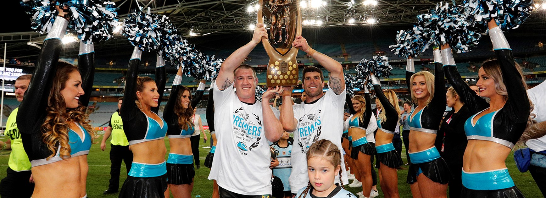 Paul Gallen and Michael Ennis with the Telstra Premiership trophy after the Sharks' grand final win.