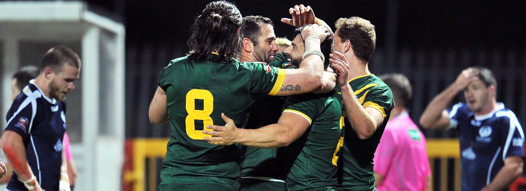 Kangaroos players celebrate during their Four Nations win over the Bravehearts.