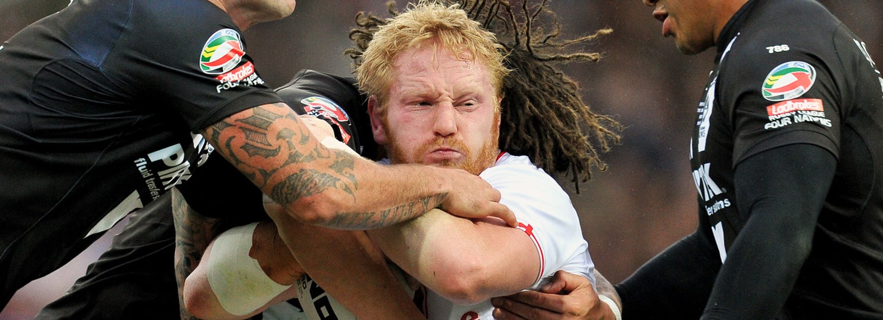 England prop James Graham tackled by the New Zealand defence.