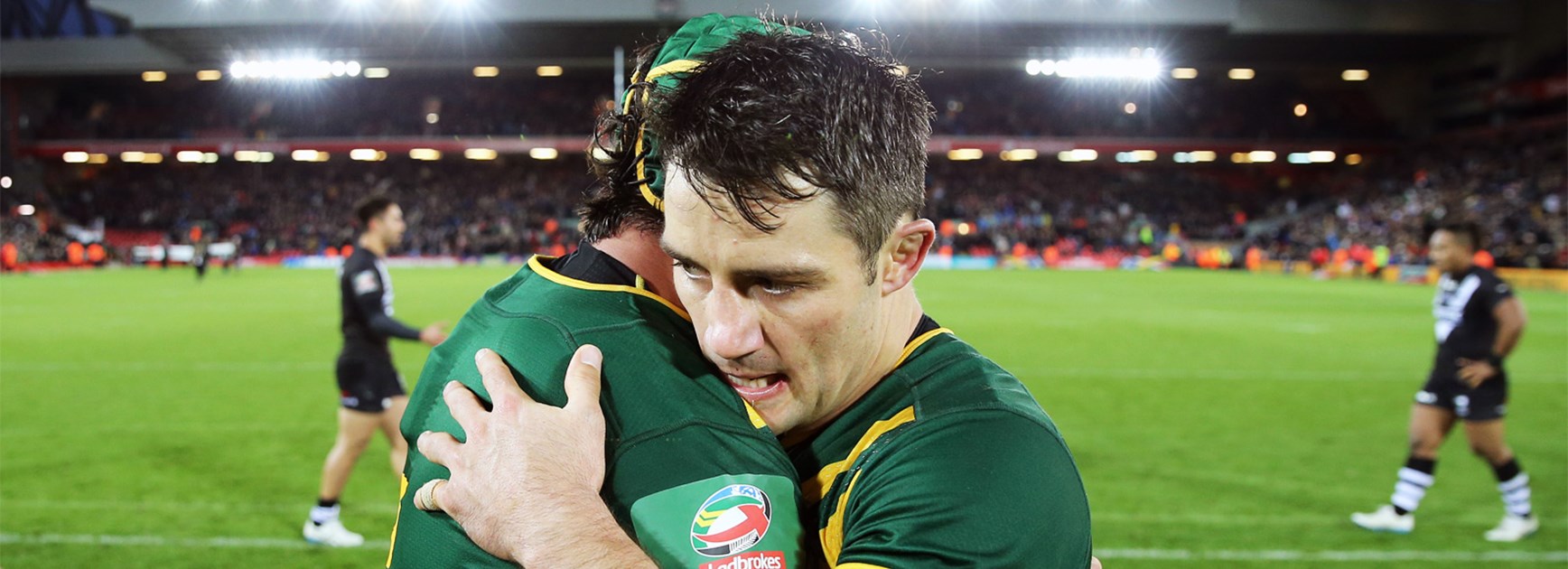 Cooper Cronk embraces Johnathan Thurston after Australia's Four Nations triumph.