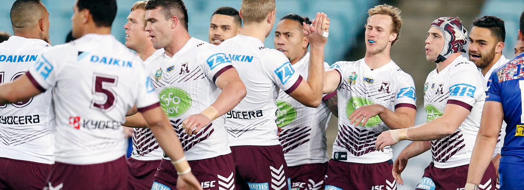 Sea Eagles players celebrate against the Bulldogs in Round 23.