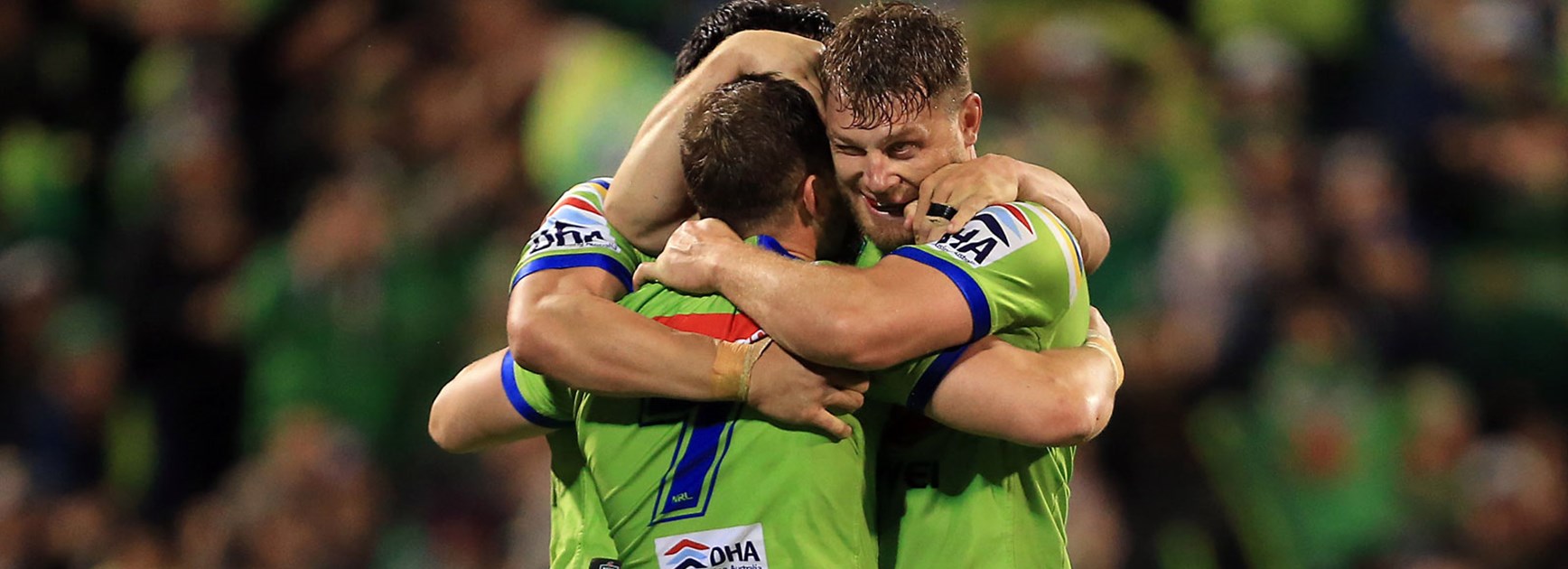 Raiders players embrace during their semi-final win over the Panthers.
