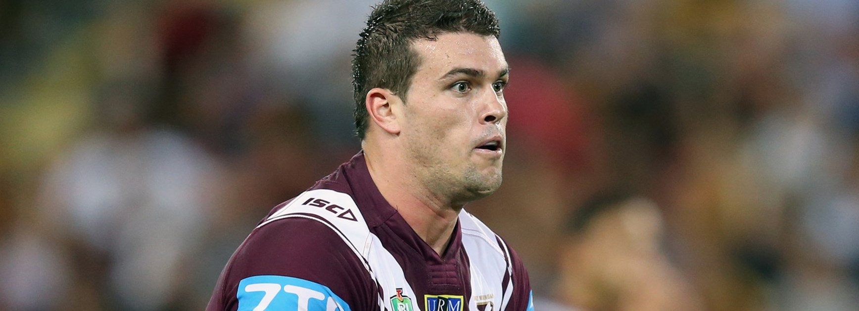 Manly prop Darcy Lussick charges forward against the Broncos.