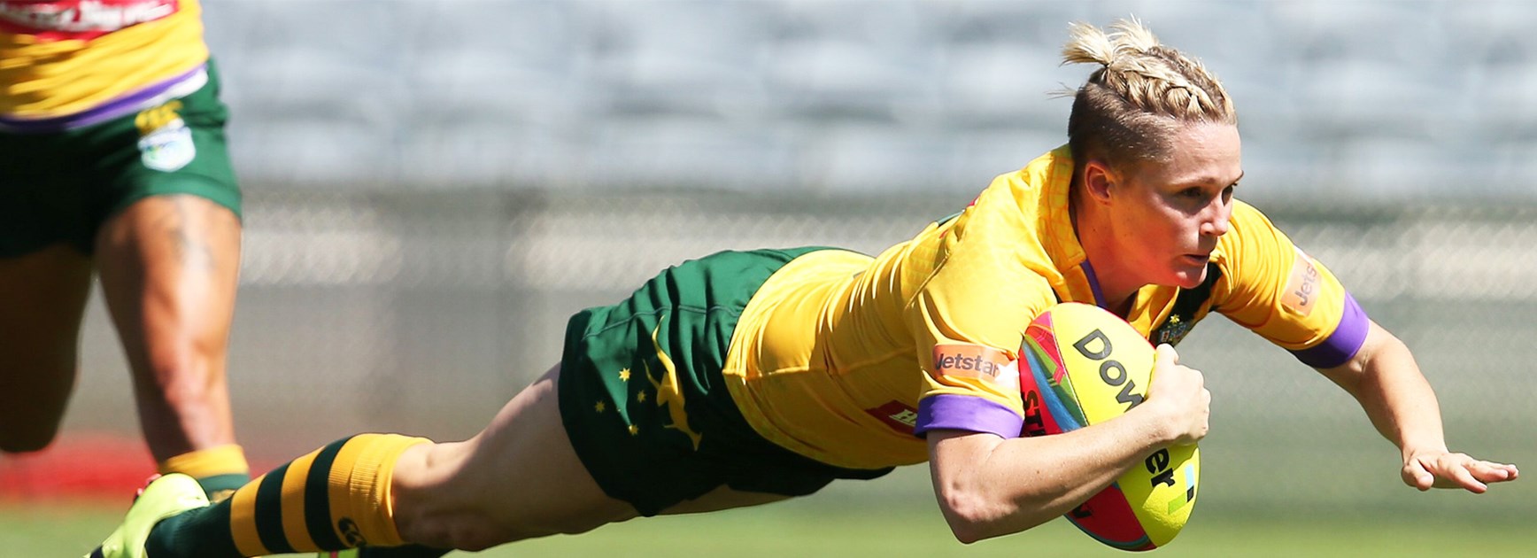 Chelsea Baker dives over to score one of her two tries against New Zealand on Saturday.