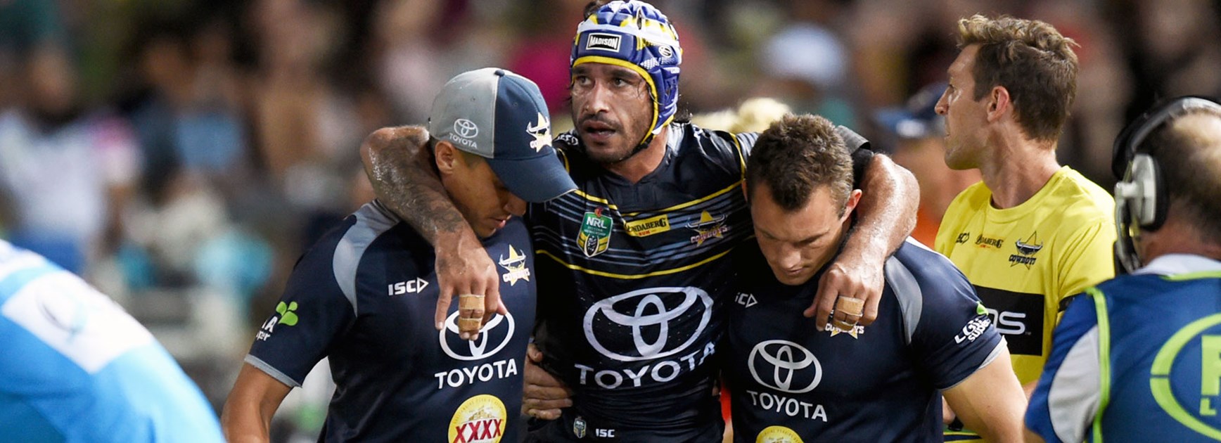 Cowboys half Johnathan Thurston was assisted from the field during his side's loss to the Tigers.