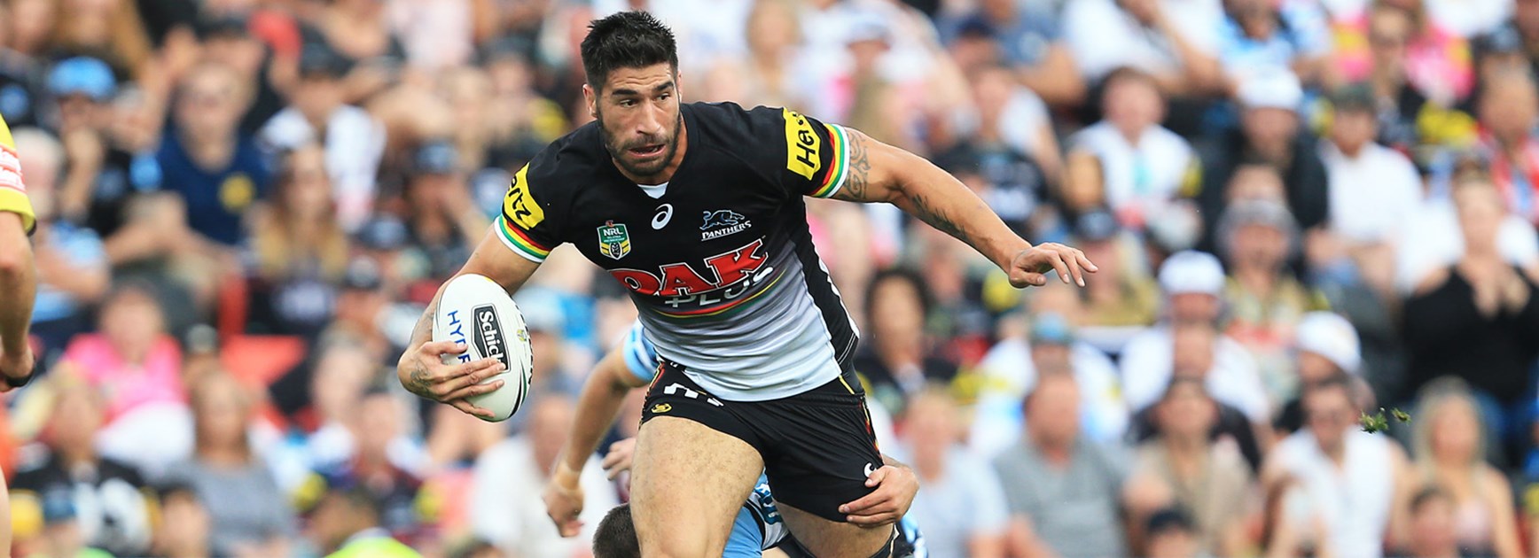 James Tamou takes a charge for the Panthers against Cronulla.