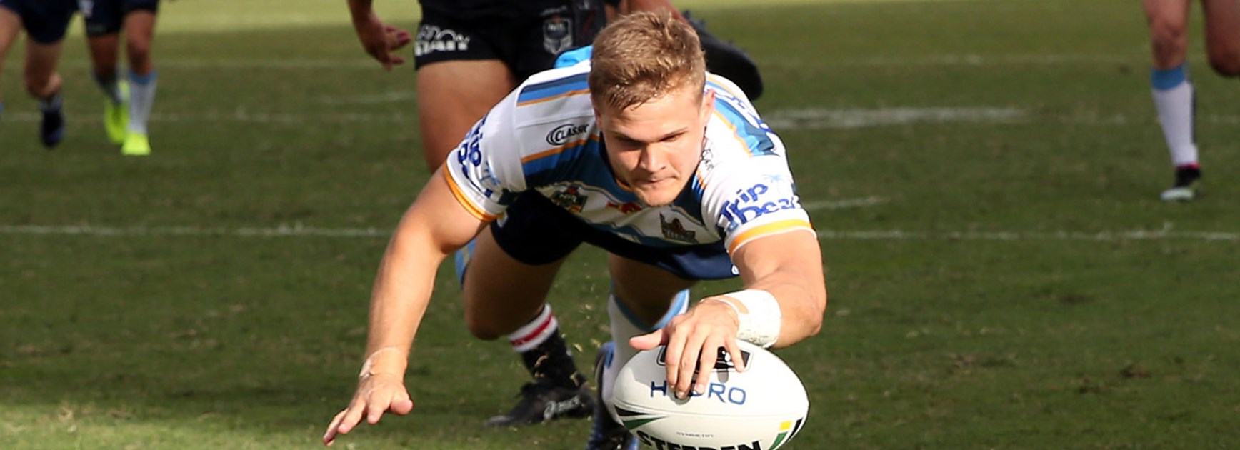 Titans centre Dale Copley crosses for a try against the Warriors in Round 5.