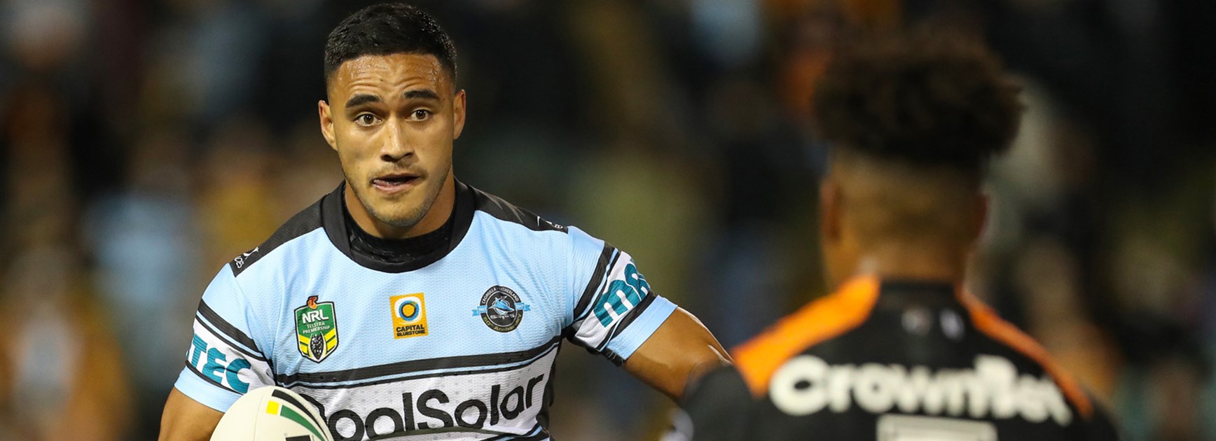 Sharks fullback Valentine Holmes takes on the Wests Tigers defence.