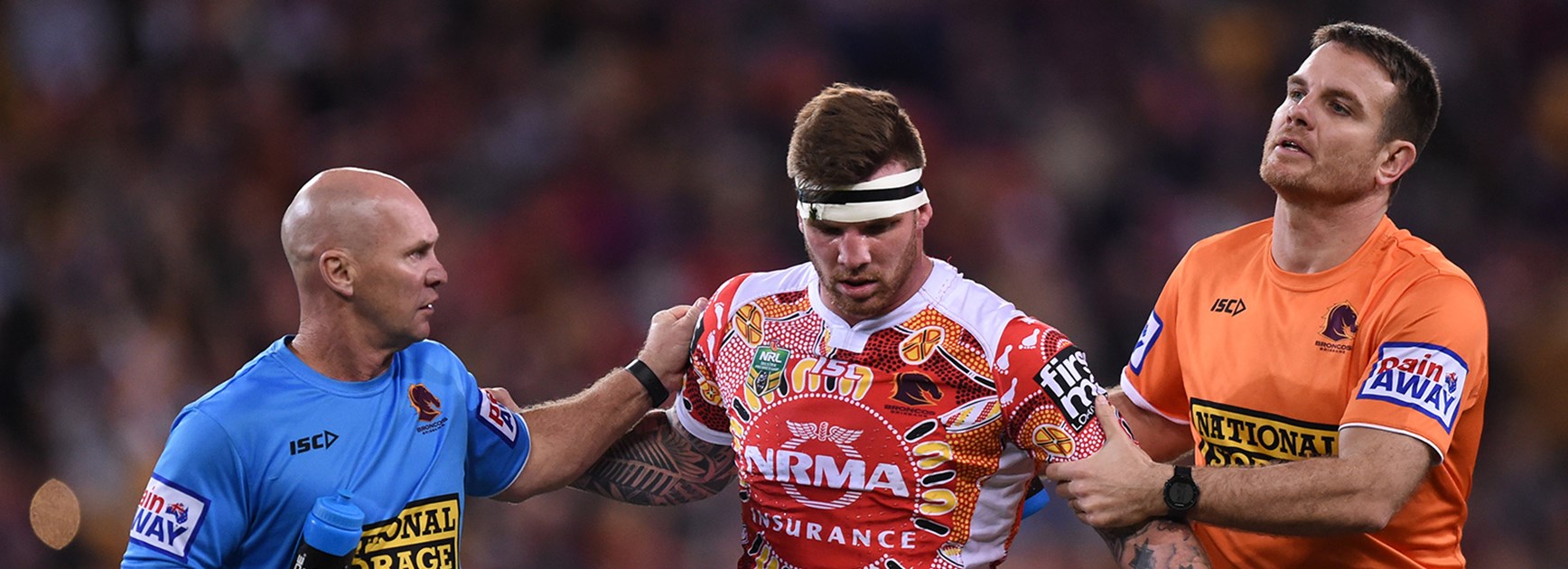 Josh McGuire leaves the field after a concussion.