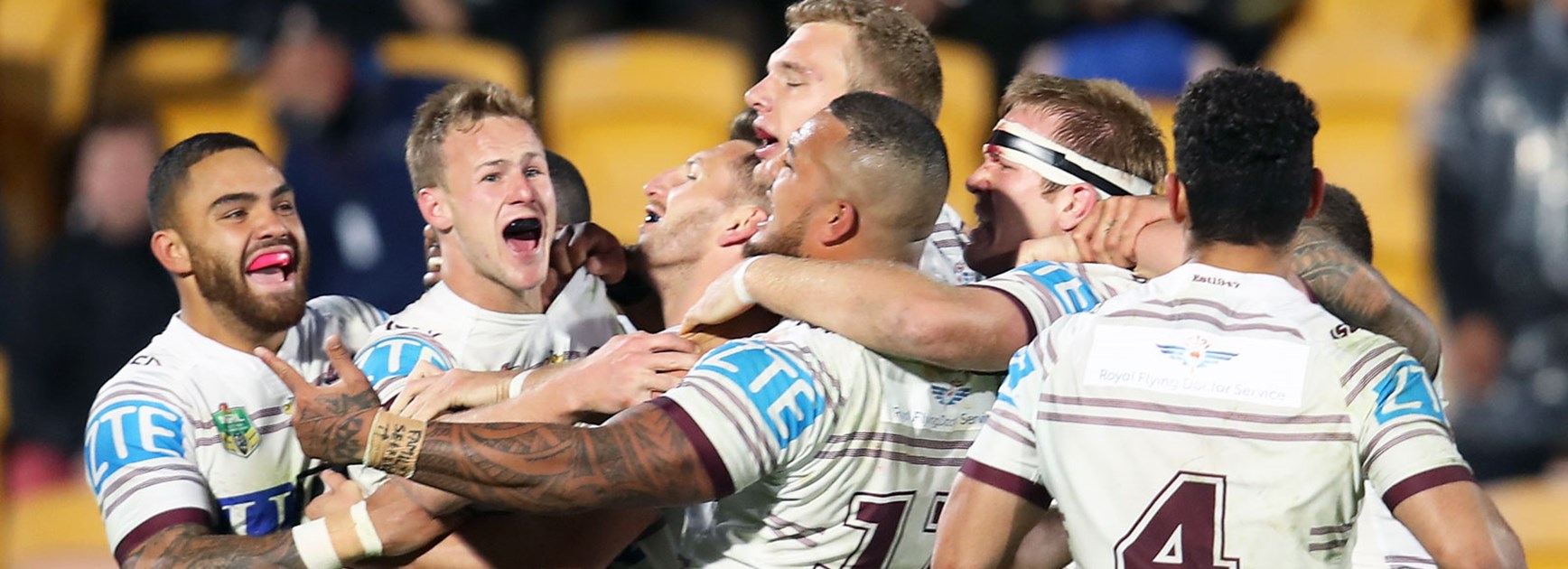 Sea Eagles players celebrate their dramatic win over the Warriors.