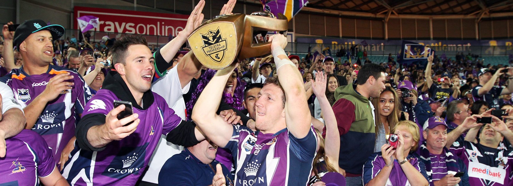 Ryan Hoffman celebrates with Storm fans after the 2012 NRL Grand Final.
