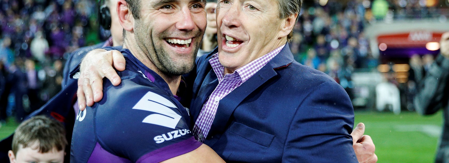 Cameron Smith and Craig Bellamy celebrate after winning the 2017 grand final.