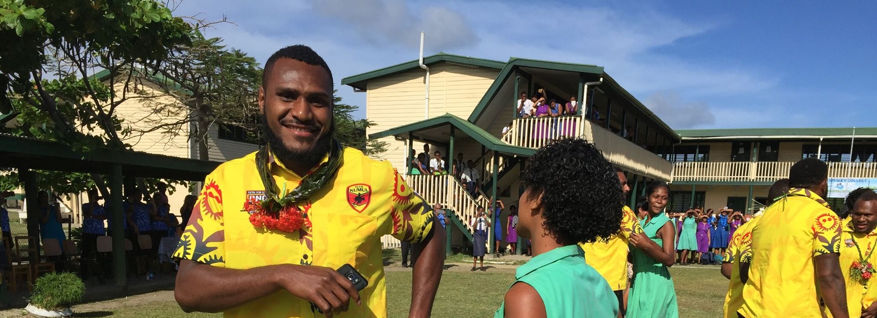 Kato Ottio dances with a PNG rugby league fan.