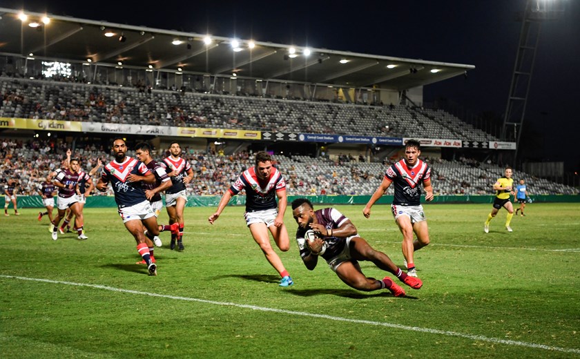 Sea Eagles winger Akuila Uate scores against the Roosters.