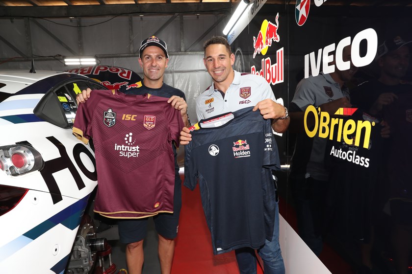 Jamie Whincup and Billy Slater swap shirts in Melbourne. 