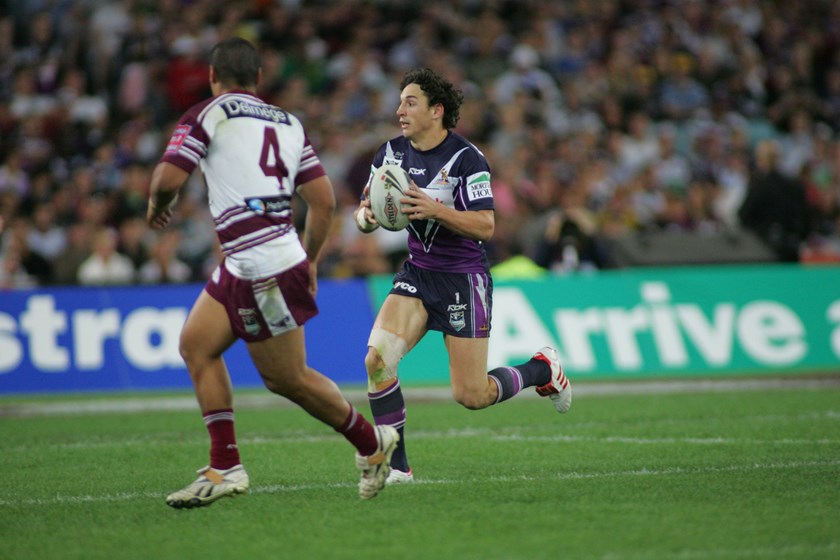 Billy Slater takes on the Manly defence.